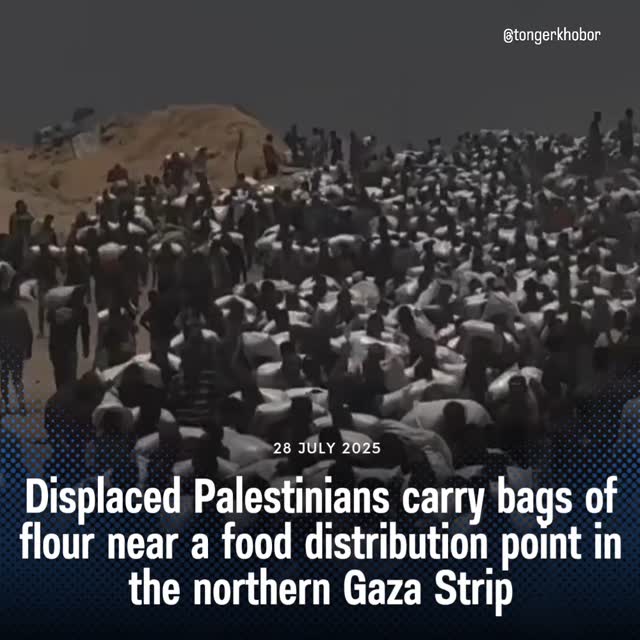 Displaced Palestinians carry bags of flour near a food distribution point in the northern Gaza Strip on 27 July 2025, after humanitarian aid trucks en...